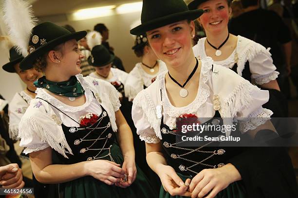 Women wearing folk costumes from the Allgaeu region of southern Bavaria attend the International Green Week agricultural trade fair on January 16,...