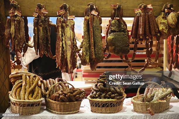 Dried meats and sausage from Romania hang on display at the International Green Week agricultural trade fair on January 16, 2015 in Berlin, Germany....