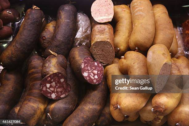 Rotwurst and leberwurst sausages await visitors at a stand at the International Green Week agricultural trade fair on January 16, 2015 in Berlin,...
