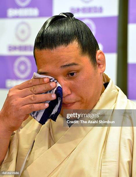 Veteran sumo wrestler Homasho sheds tears during a press conference to announce his retirement during day six of the Grand Sumo New Year tournament...