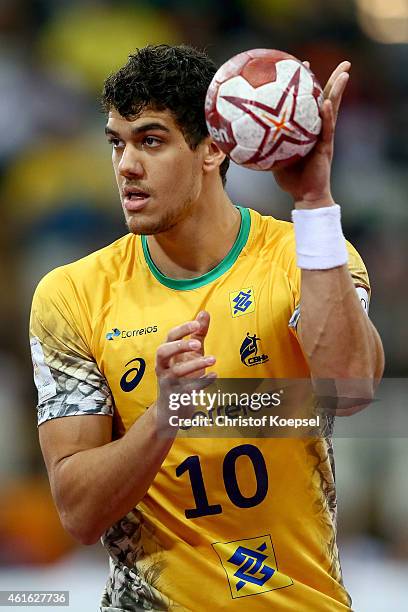 Guilhermo de Toledo of Brazil passes the ball during the IHF Men's Handball World Championship group A match between Qatar and Brazil at Lusail...