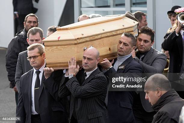 Peole carry the coffin of Stephane Charbonnier, also known as Charb, the publishing director of the satirical paper Charlie Hebdo during his funeral...