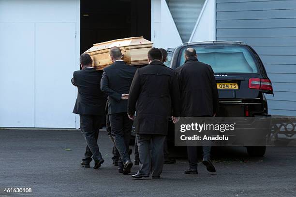 Peole carry the coffin of Stephane Charbonnier, also known as Charb, the publishing director of the satirical paper Charlie Hebdo during his funeral...