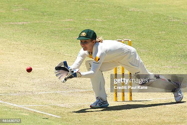 Jodie Fields of Australia fields a return throw during day one of the Women's Ashes Test match between Australia and England at the WACA on January...