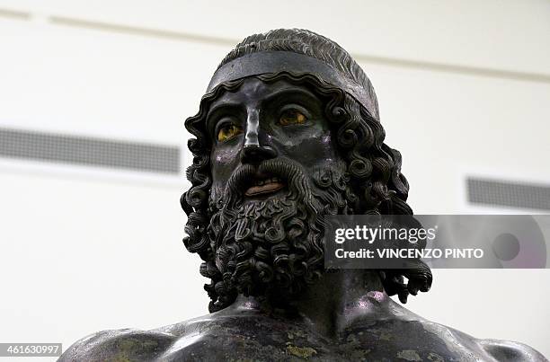 The 2,500-year-old Riace Bronzes are displayed in a renovated Reggio Calabria National Archeological Museum on January 9 following four years of...