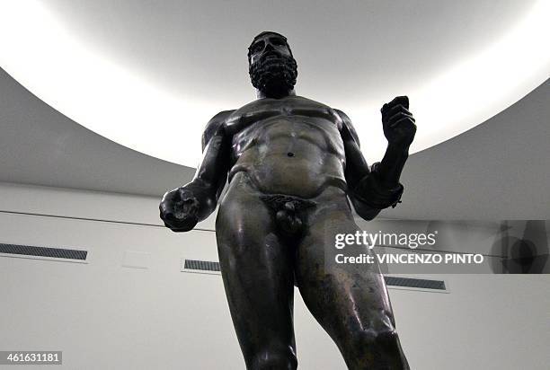 The 2,500-year-old Riace Bronzes are displayed in a renovated Reggio Calabria National Archeological Museum on January 9 following four years of...