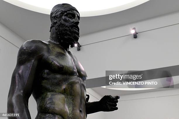 The 2,500-year-old Riace Bronzes are displayed in a renovated Reggio Calabria National Archeological Museum on January 9 following four years of...