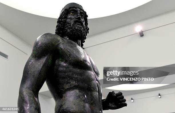 The 2,500-year-old Riace Bronzes are displayed in a renovated Reggio Calabria National Archeological Museum on January 9 following four years of...