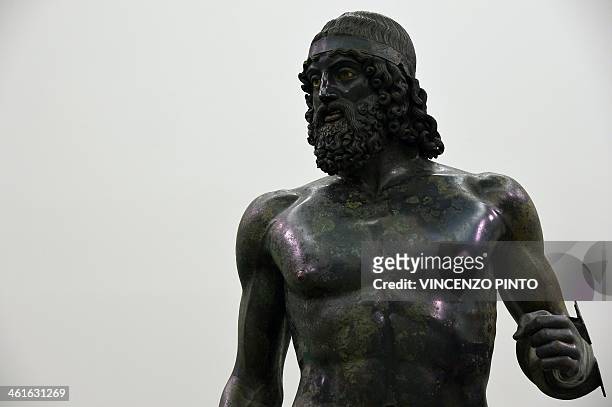 The 2,500-year-old Riace Bronzes are displayed in a renovated Reggio Calabria National Archeological Museum on January 9 following four years of...