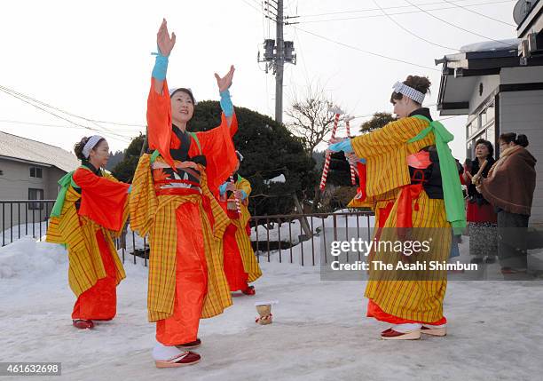 Women wearing colourful kimonos perform the 'rice planting and rice-cake making' dance at Mena Shrine in prayer for good harvest on January 12, 2015...