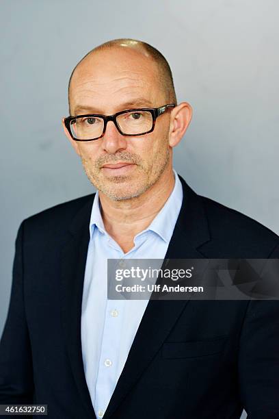 French writer Laurent Mauvignier poses during portrait session held on September 23, 2014 in Paris, France.
