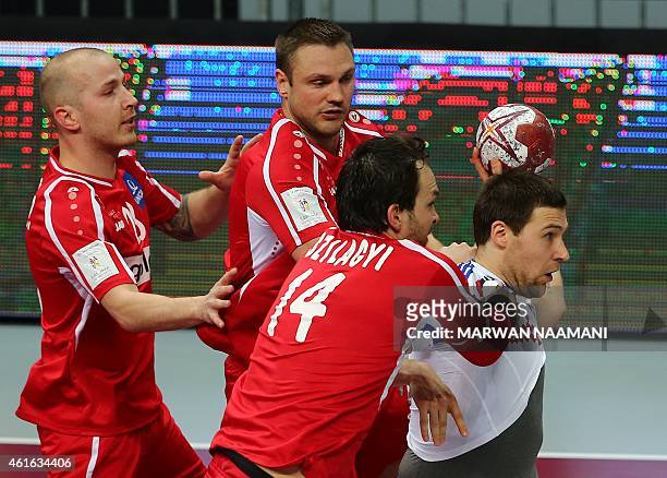Croatia's Ivan Cupic fights for the ball during the 24th Men's Handball World Championships preliminary round Group B match Croatia vs Austria at the...