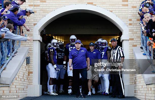 Head coach Gary Patterson of the TCU Horned Frogs stands with his team before the Big 12 college football game against the Iowa State Cyclones at...