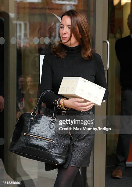 Rebecca Deacon carries a 'memory box' presented to Catherine, Duchess of Cambridge containing stories and poems written by children brought up in...