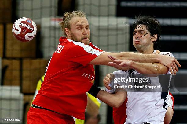 Mikkel Hansen of Denmark defends against Federico Vieyra of Argentina during the IHF Men's Handball World Championship group D match between Denmark...