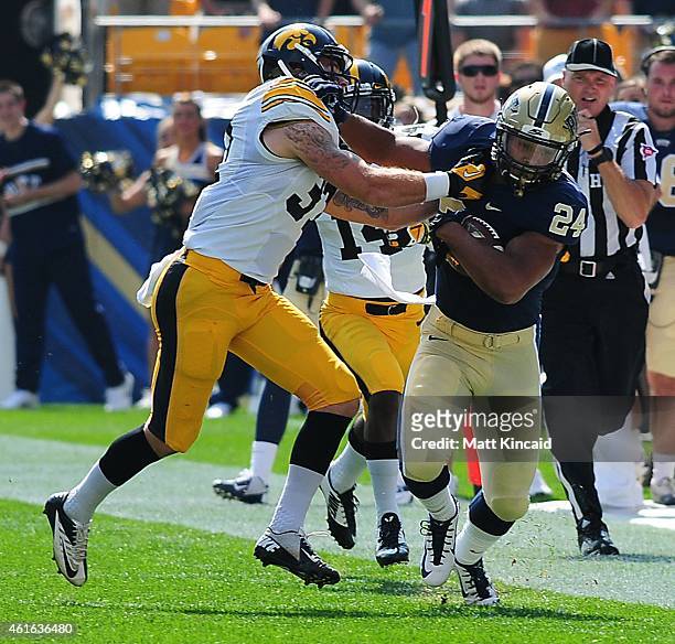 Tailback James Conner of the University of Pittsburgh Panthers runs with the ball against the University of Iowa Hawkeyes during a college football...
