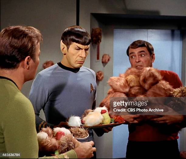 Star Trek the Original Series Season 2 Episode 15 " The Trouble With Tribbles " Pictured from left: William Shatner as Captain James T. Kirk, Leonard...