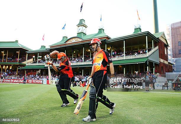 Simon Katich and Craig Simmons of the Scorchers walk out to bat during the Big Bash League match between the Sydney Sixers and the Perth Scorchers at...