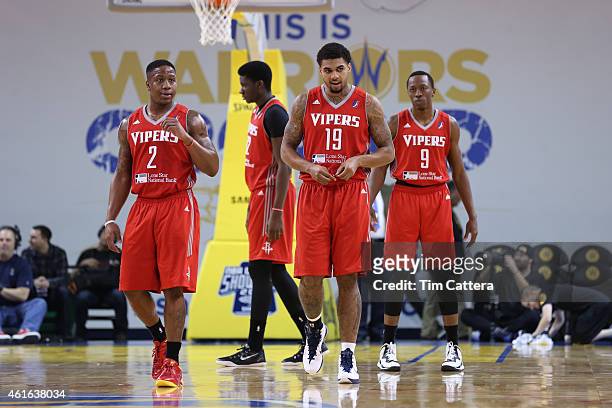 Glen Rice Jr, Isaiah Canaan and Jaron Johnson of the Rio Grande Valley Vipers walk on the court after a timeout against the Erie Bayhawks during the...