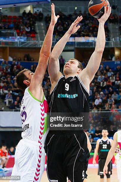 Artsiom Parakhouski, #9 of Nizhny Novgorod competes with Mirza Begic, #15 of Laboral Kutxa Vitoria in action during the Euroleague Basketball Top 16...