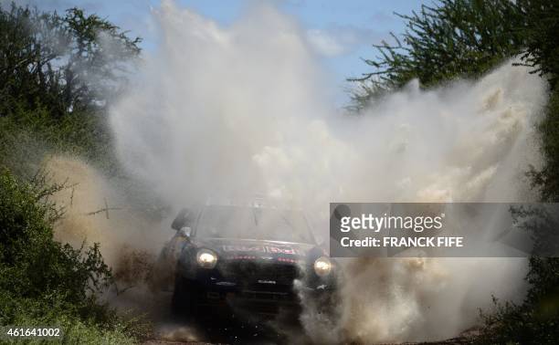 Mini's driver Nasser Al-Attiyah of Qatar and co-driver Mathieu Baumel of France compete during the Stage 12 of the 2015 Dakar Rally between Termas de...