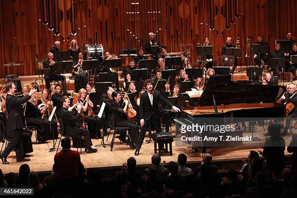Italian pianist Federico Colli receives applauds after performing Rachmaninov Piano Concerto No 3 as conductor Sakari Oramo lead the BBC Symphony...