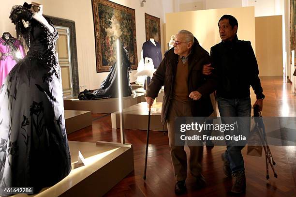 Italian costume designer Piero Tosi looks his dress worn by Laura Antonelli for the movie 'The Innocent' by Luchino Visconti during the 'I Vestiti...