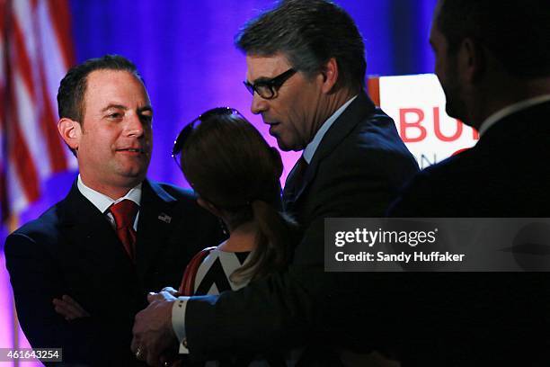 Texas Governor Rick Perry and RNC Chairman Reince Preibus speak to fellow Republicans during a luncheon meeting during the Republican National...