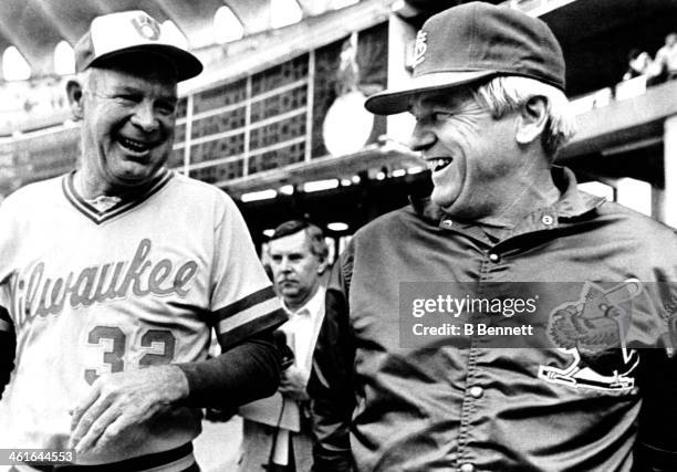 Manager Harvey Kuenn of the Milwaukee Brewers talks with manager Whitey Herzog of the St. Louis Cardinals before Game 1 of the 1982 World Series on...