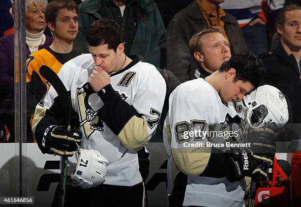 Pittsburgh Penguins stars Evgeni Malkin and Sidney Crosby pause prior to their game against against the New York Islanders at the Nassau Veterans...