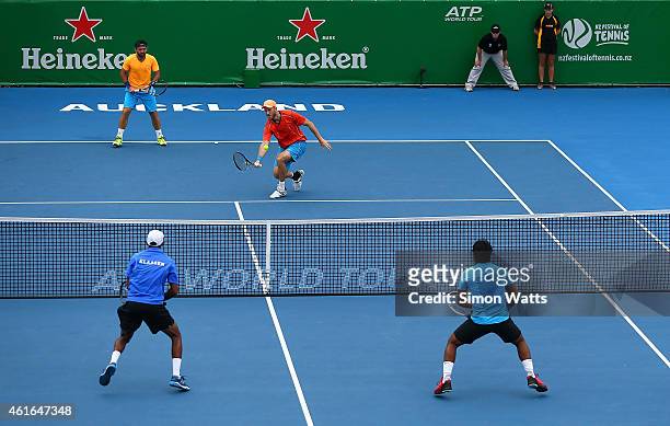 Dominic Inglot of Great Britain and Florin Mergea of Romania play a shot during their doubles final match against Leander Paes of India and Raven...
