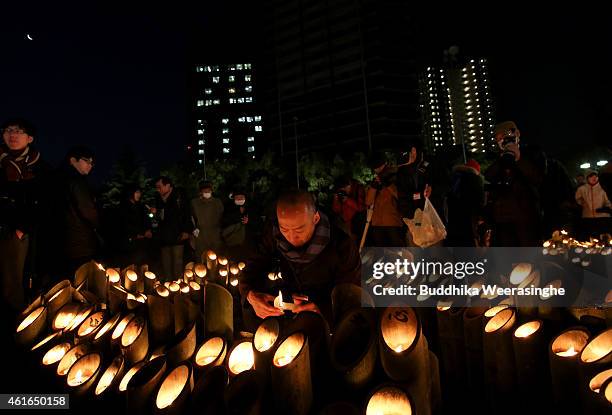 Japanese people light up a bamboo lanterns to pray for the victims of the Great Hanshin Earthquake, marking the 20th anniversary on January 17, 2015...