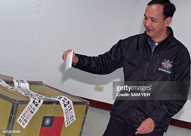 Eric Chu, vice chairman of the ruling Kuomintang , casts his vote in the party's election at a polling station in New Taipei City on January 17,...