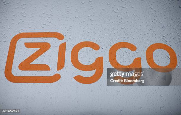 Drops of rain water sit on the company logo of a Ziggo NV internet technician's truck in Heerhugowaard, Netherlands, on Thursday, Jan. 9, 2014....