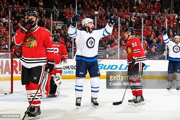 Chris Thorburn of the Winnipeg Jets reacts after scoring against the Chicago Blackhawks in the third period during the NHL game at the United Center...