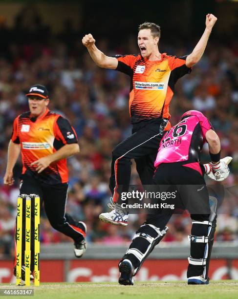 Jason Behrendorff of the Scorchers celebrates taking the wicket of Marcus North of the Sixers during the Big Bash League match between the Sydney...