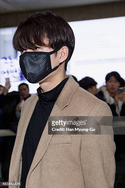 Woohyun of South Korean boy band Infinite is seen upon arrival at Gimpo International Airport on January 16, 2015 in Seoul, South Korea.
