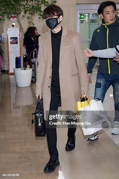 Woohyun of South Korean boy band Infinite is seen upon arrival at Gimpo International Airport on January 16, 2015 in Seoul, South Korea.