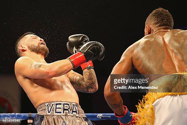 Willie Monroe Jr. Punches Bryan Vera during their NABA/NABO middleweight championship fight at the Turning Stone Resort Casino on January 16, 2015 in...