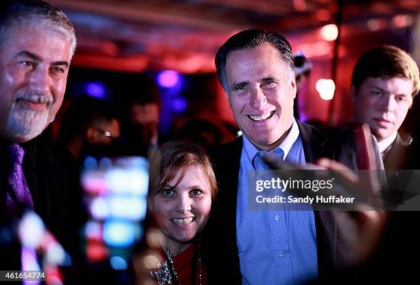Mitt Romney greets fellow Republicans at a dinner during the Republican National Committee's Annual Winter Meeting aboard the USS Midway on January...