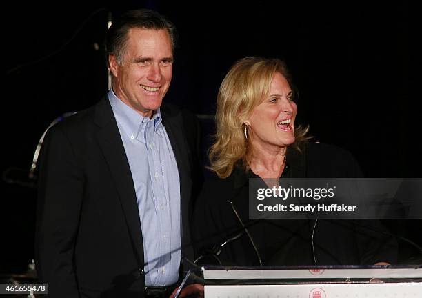 Mitt Romney speaks to fellow Republicans with his wife Ann Romney at a dinner during the Republican National Committee's Annual Winter Meeting aboard...