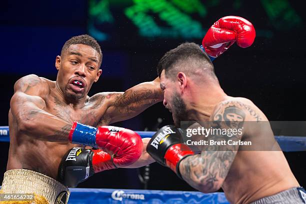 Bryan Vera connects with a right to the body against Willie Monroe, Jr. In the 2nd round of their Middleweight Championship match during ESPN's...