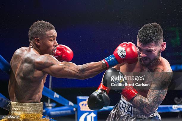 Willie Monroe, Jr. Connects with a right against Bryan Vera during 10th round of their Middleweight Championship match during ESPN's Friday Night...
