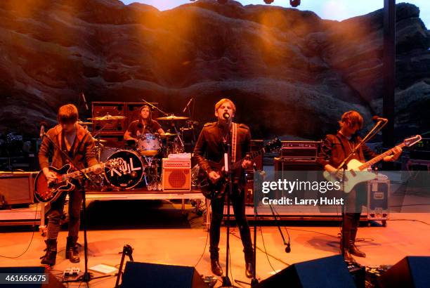 Matthew Followill, Nathan Followill, Caleb Followill and Jared Followill performs with 'The Kings of Leon' at the Red Rocks Amplitaheater in...