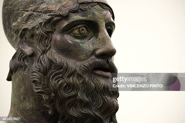 The 2,500-year-old Riace Bronzes are displayed in a renovated Reggio Calabria National Archeological Museum on January 9 following four years of...