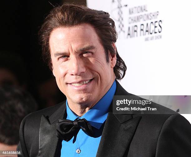 John Travolta arrives at the 12th Annual "Living Legends of Aviation" Awards held at The Beverly Hilton Hotel on January 16, 2015 in Beverly Hills,...