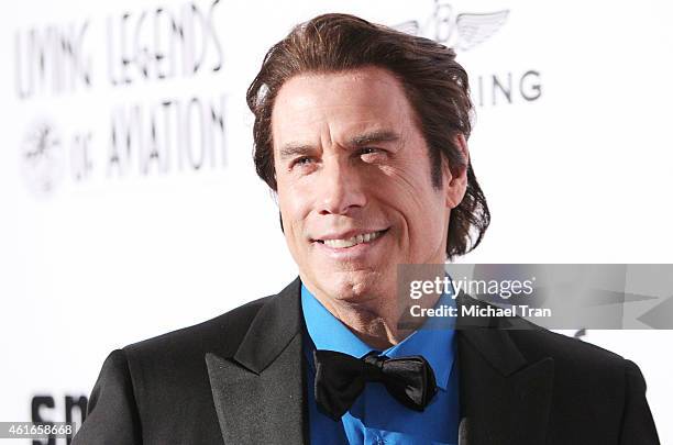 John Travolta arrives at the 12th Annual "Living Legends of Aviation" Awards held at The Beverly Hilton Hotel on January 16, 2015 in Beverly Hills,...