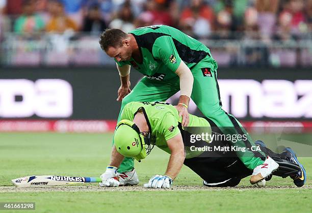 John Hastings of the Stars climbs over Aiden Blizzard of the Thunder to get the ball during the Big Bash League match between the Sydney Thunder and...