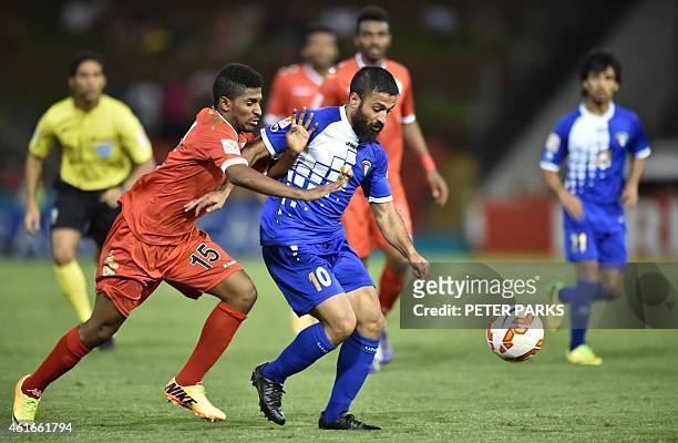 Salim Al Nahar of Oman and Aziz Mashaan of Kuwait fight for the ball during their Group A football match of the AFC Asian Cup in Newcastle on January...