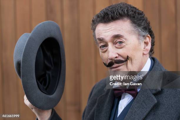 Robert Powell attends a photocall for the theatre production of Agatha Christie's "Black Coffee" at the writer's former residence on January 10, 2014...